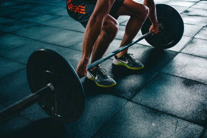 person-holding-barbell
