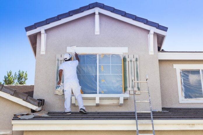 House-Painter-Painting-the-Trim-And-Shutters-of-Home