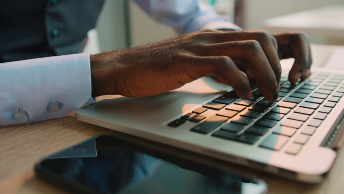 black-man-behind-laptop