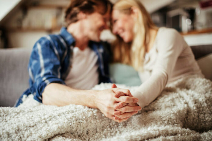Mature couple holding hands